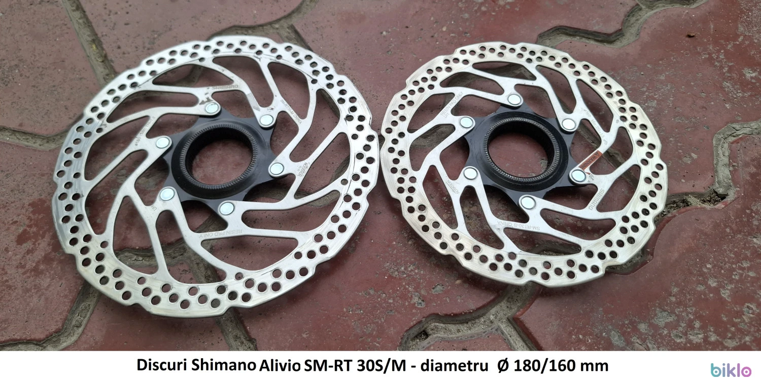 1. Discuri frana Shimano Alivio SM-RT 30S/M, diametru Ø 160/180 mm, prindere center-lock