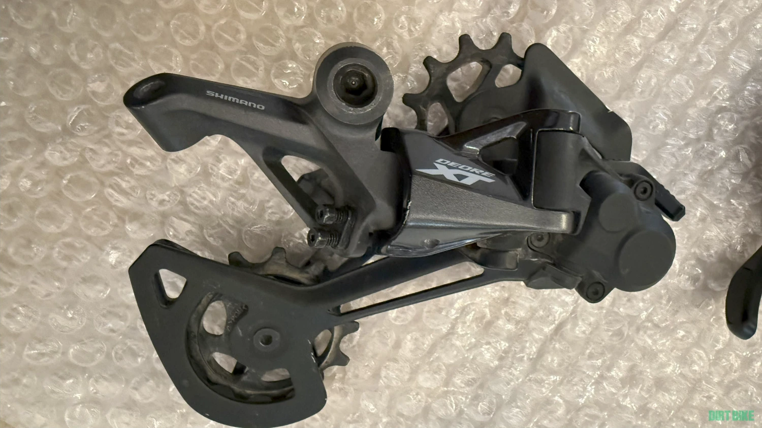 1. Schimbator + maneta Shimano XT 1x12 ca nou