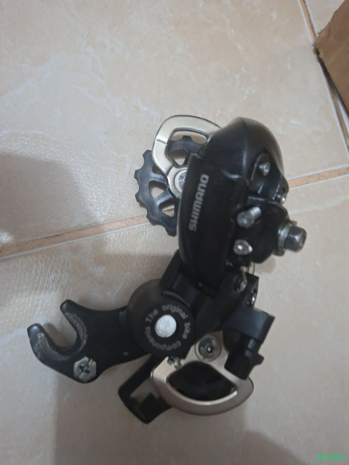 4. Schimbator pinioane Shimano Turney prindere ax