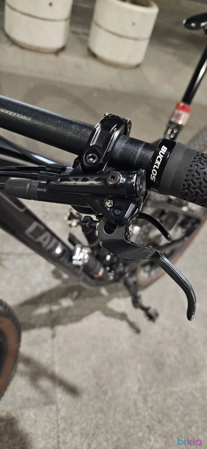 3. Set frâne față-spate Shimano SLX M7120 4-pistoane