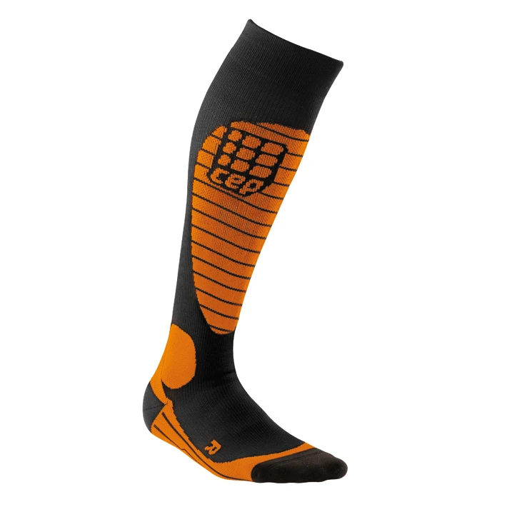 1. CEP - sosete lungi compresie ski pentru femei Ski Race Socks - negru portocaliu intens