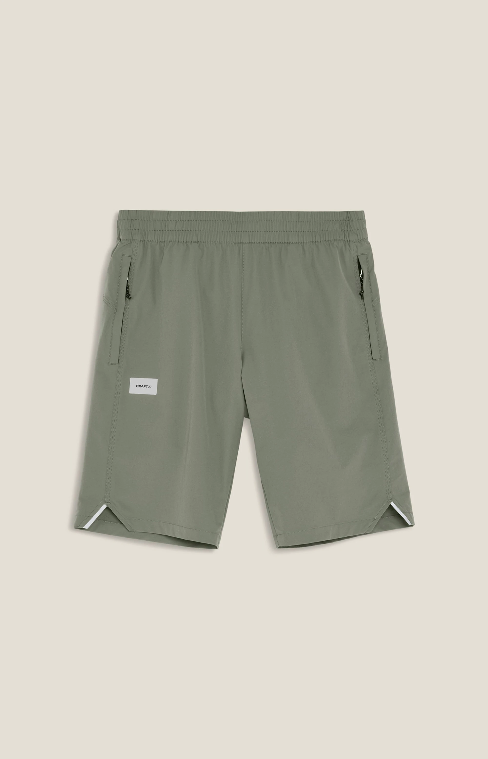 1. Pantaloni scurți ciclism Craft Everyday Shorts cu bazon C4 bărbați - verzi