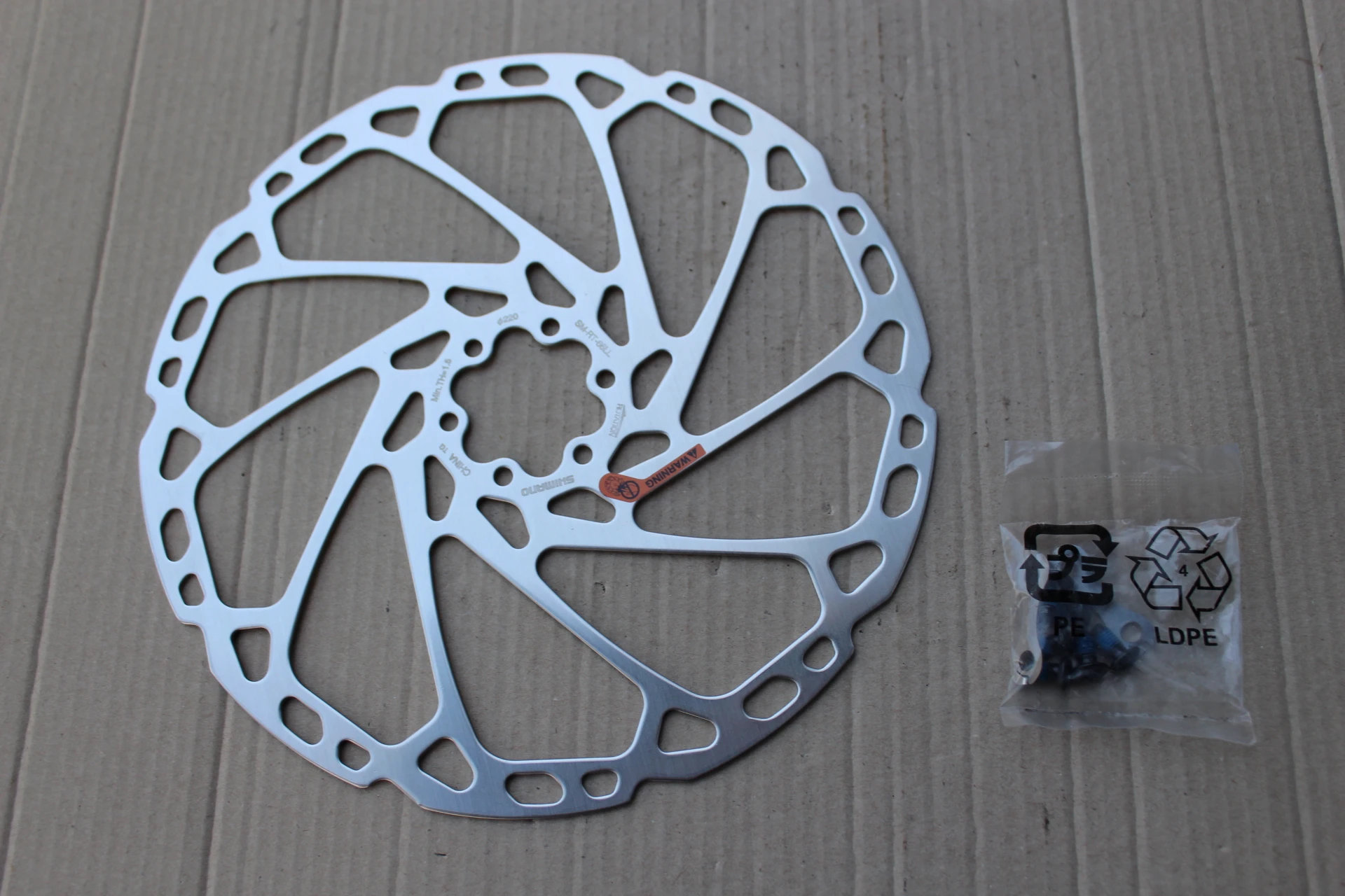 1. Shimano SM-RT66LL SLX - 220mm disc rotor