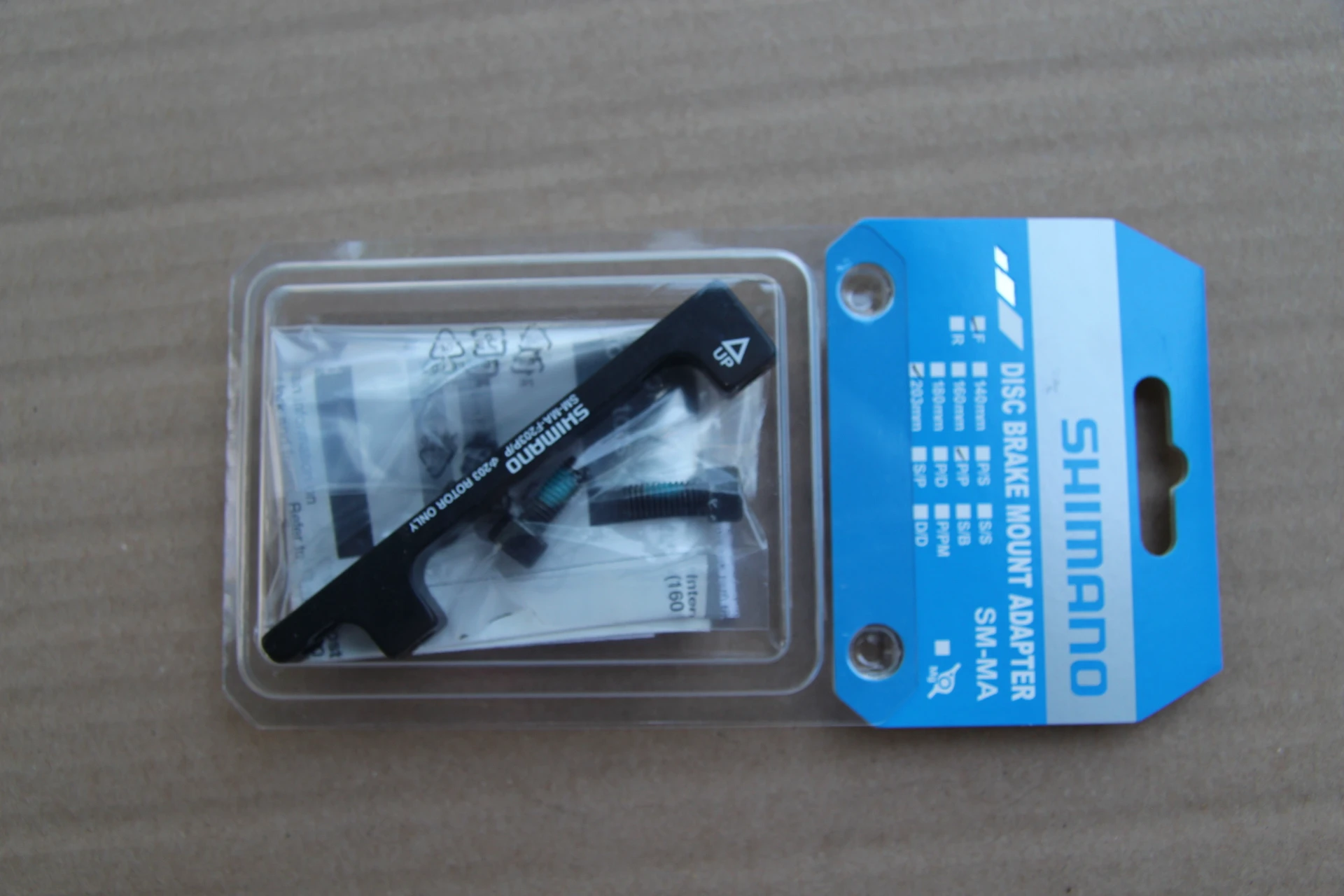 1. Adaptor Shimano fata 203mm PostMount P/P CNC + suruburi