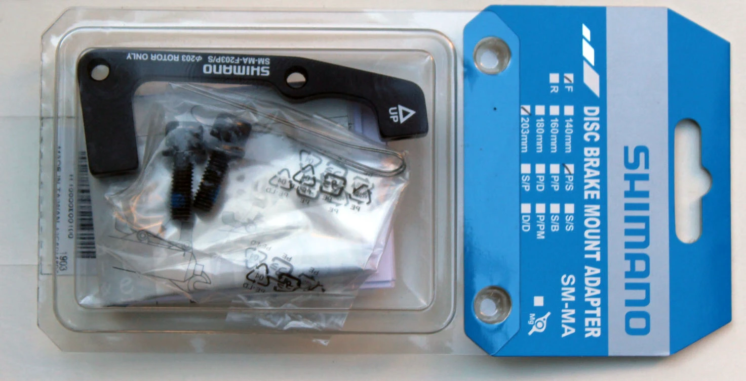 1. Adaptor Shimano IS 203mm fata SM-MA F20P/S
